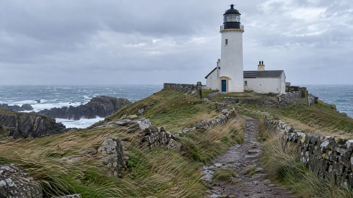 Lighthouse isolated by rough coastal weather